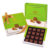 Bolci - Kadayif Chocolate With Pistachio Kadayif Filled Milk Chocolate Gift Box (256g) shown open with chocolates visible, next to the closed box and coordinating green gift bag.